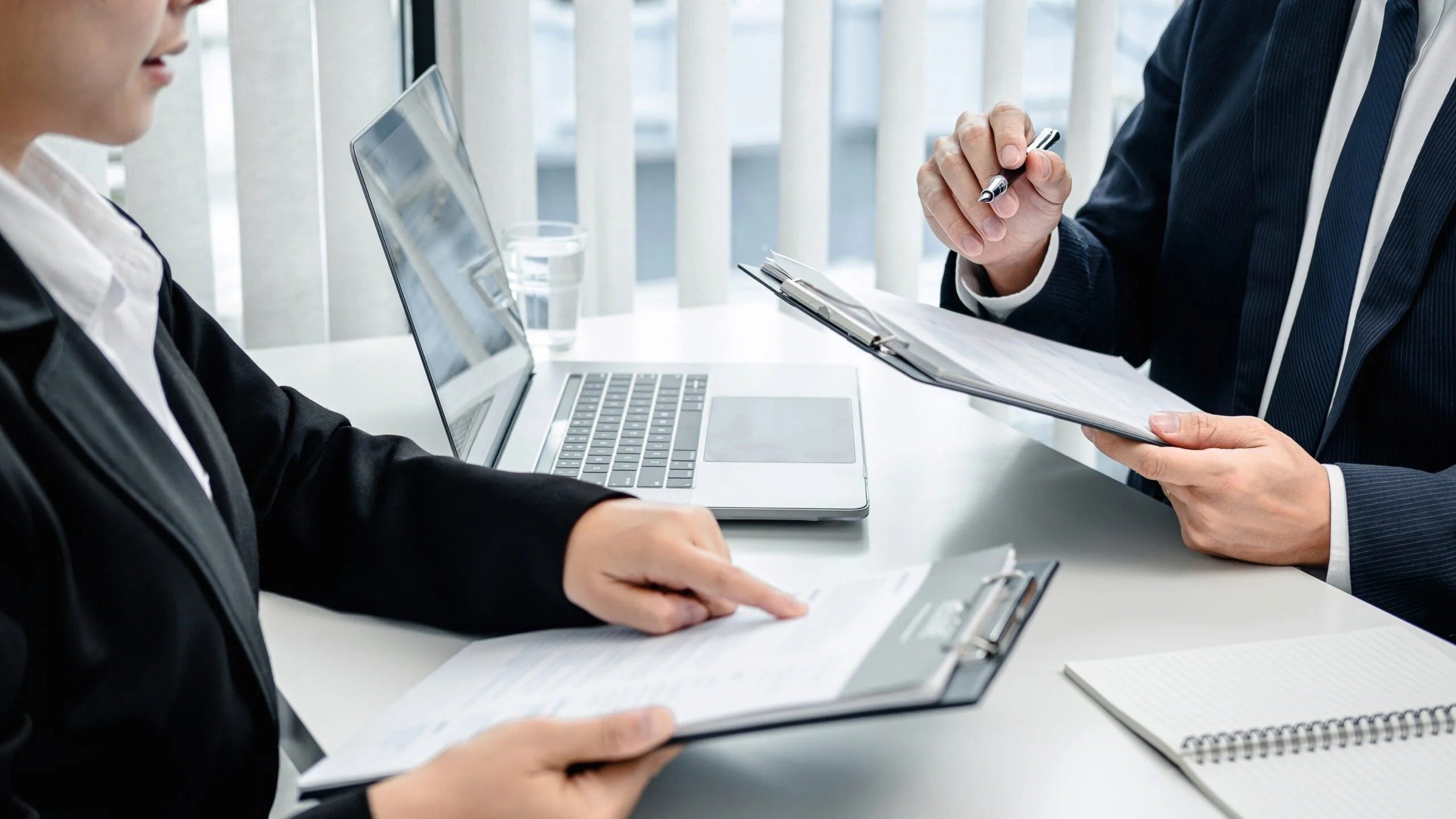 Compliance professionals reviewing regulated documents